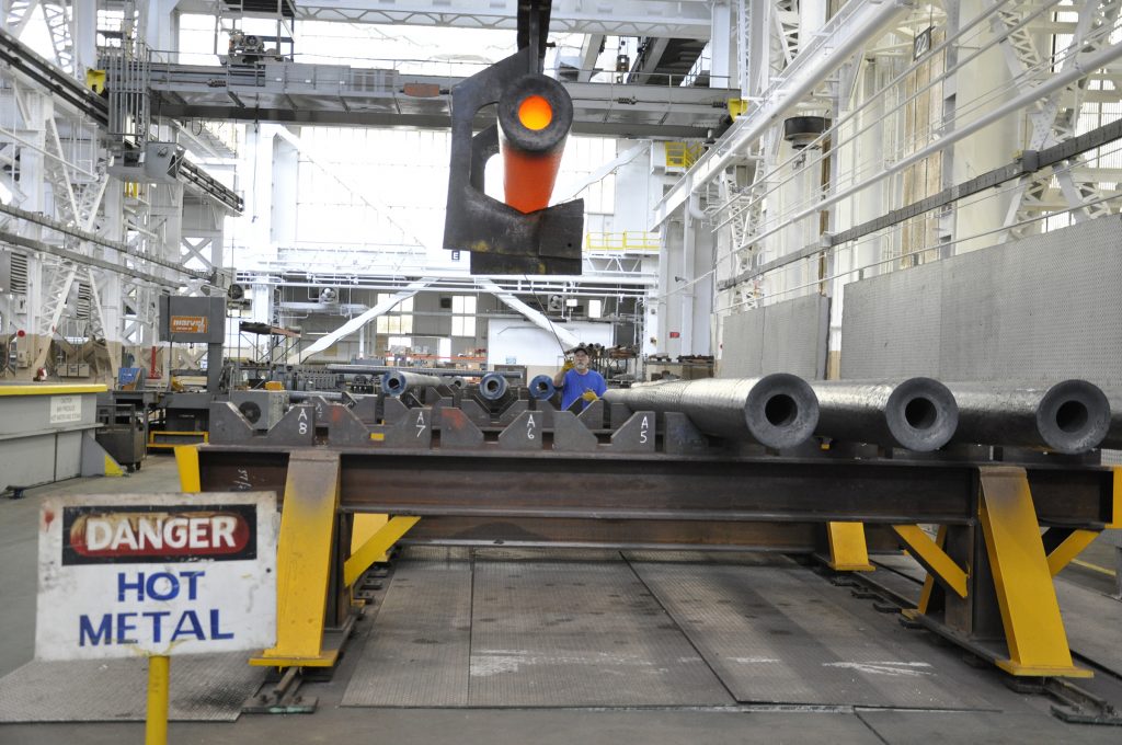A 155mm howitzer tube is moved from the arsenal's rotary forge where it was heated to nearly 2,000 degrees and pounded into the near shape of a cannon tube.